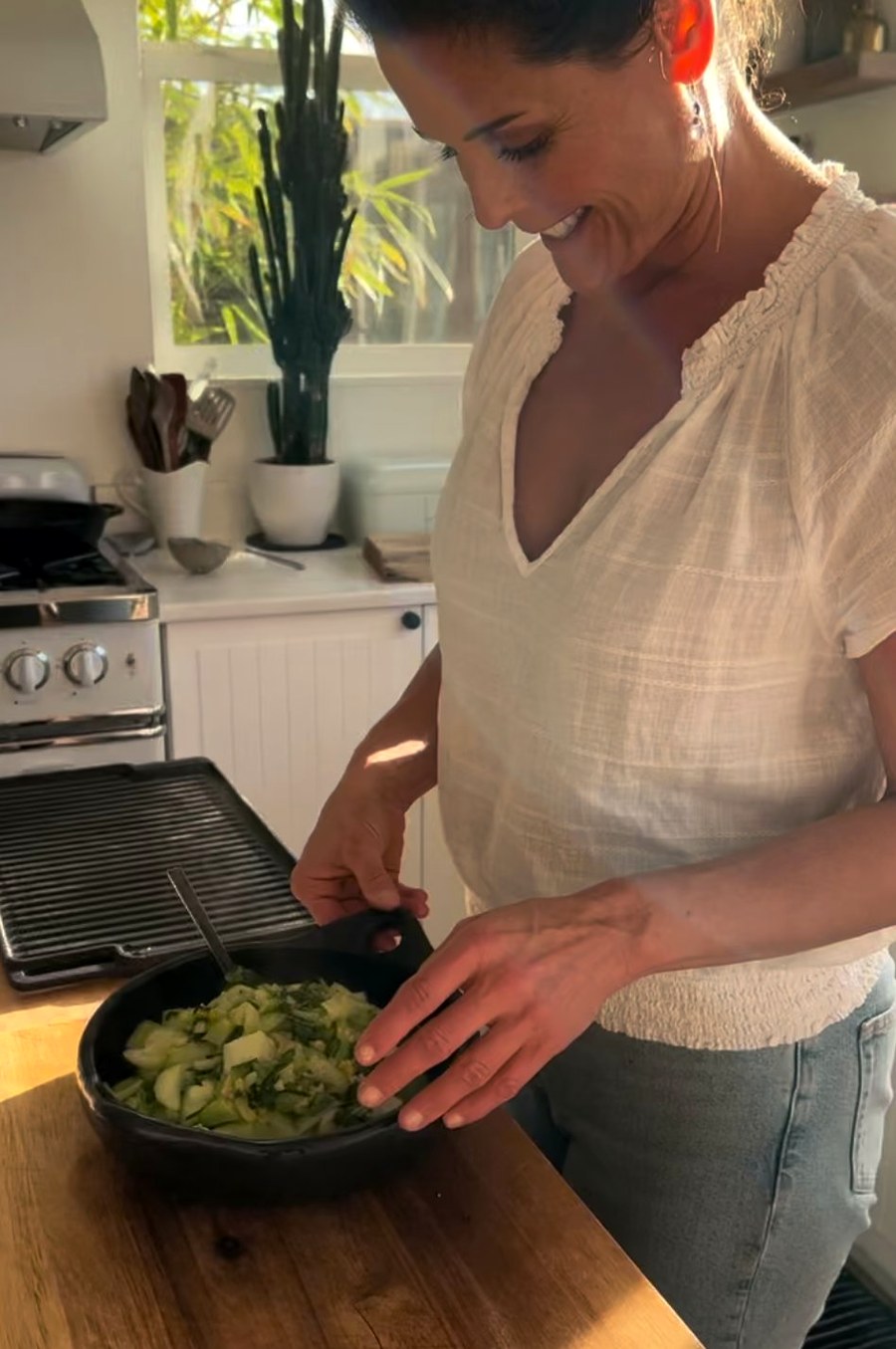 Helene Leeds in her kitchen, preparing real food in evening light